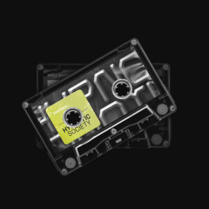 A black and white photo of two cassette tapes.