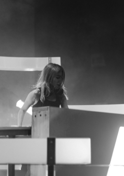 A woman standing in front of a podium.